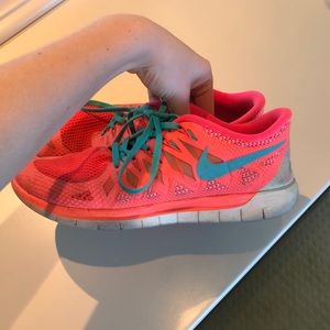 Worn women’s Nike’s free 5.0 size 10,  pink/orange